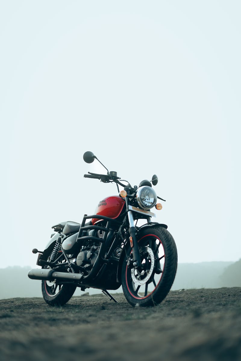 A Royal Enfield Meteor motorcycle parked in an outdoor setting, showcasing its design.