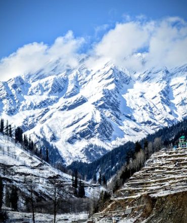 Stunning winter landscape of the snow-capped Himalayas near Manali, Himachal Pradesh, India.