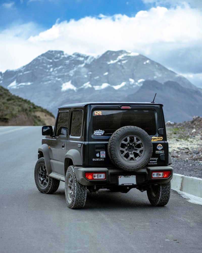 4x4 vehicle on a scenic mountain road in Canta, Peru, showcasing rugged outdoor adventure.