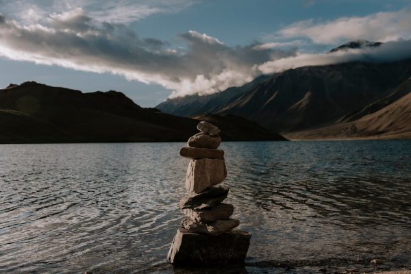 Calm waters and a rock stack at Marango Rangarik, Himachal Pradesh, India.